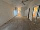 Bedroom features neutral carpet, ceiling fan and closet mirror at 10905 Se 127Th Ln, Belleview, FL 34420