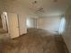 Bedroom featuring neutral carpet, ceiling fan, and mirrored closet doors at 10905 Se 127Th Ln, Belleview, FL 34420