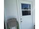 Exterior door with window, door knob and latch hardware at 1105 Hazelnut Dr, Leesburg, FL 34748