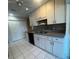 Kitchen with modern cabinetry, updated countertops, and mosaic backsplash at 1105 Hazelnut Dr, Leesburg, FL 34748