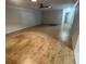 Large living room with modern flooring, ready to be transformed into your dream space at 1105 Hazelnut Dr, Leesburg, FL 34748