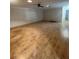 Expansive living room featuring sleek flooring and ample natural light at 1105 Hazelnut Dr, Leesburg, FL 34748