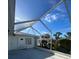Spacious enclosed patio offering views of the neighborhood and a comfortable seating area at 1105 Hazelnut Dr, Leesburg, FL 34748
