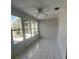Bright sunroom with tile flooring and large windows, perfect for relaxation at 1105 Hazelnut Dr, Leesburg, FL 34748