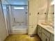 Bathroom featuring a bathtub, sink with vanity, and a tall storage cabinet offering lots of storage space at 112 Caladium St, Leesburg, FL 34748