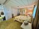Restful bedroom with closet and a dresser, providing storage and a view of adjacent areas at 112 Caladium St, Leesburg, FL 34748