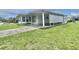 Charming single-story home featuring a covered carport and well-maintained lawn at 112 Caladium St, Leesburg, FL 34748