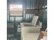 Laundry room featuring a top-load washing machine and natural light from the window at 112 Caladium St, Leesburg, FL 34748
