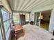 Relaxing sunroom with windows, perfect for enjoying the outdoors from inside at 112 Caladium St, Leesburg, FL 34748