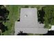 Aerial view of the roof and backyard surrounded by mature trees at 11401 Cypress Dr, Clermont, FL 34711