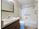 Bathroom with vanity, toilet, and tub/shower combination at 11401 Cypress Dr, Clermont, FL 34711