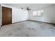 Spacious bedroom with ceiling fan and window providing natural light at 11401 Cypress Dr, Clermont, FL 34711