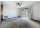 Bedroom with a view of the water and a ceiling fan at 11401 Cypress Dr, Clermont, FL 34711