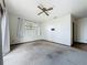 View of the bedroom with a window and neutral carpet at 11401 Cypress Dr, Clermont, FL 34711