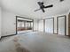 Large bedroom features sliding glass door to lanai and closet space at 11401 Cypress Dr, Clermont, FL 34711