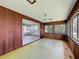 Enclosed lanai with sliding doors and windows providing natural light and water views at 11401 Cypress Dr, Clermont, FL 34711
