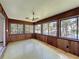 Enclosed lanai with multiple windows offering a serene waterfront view at 11401 Cypress Dr, Clermont, FL 34711