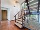 Staircase with a large window and a chandelier at 11401 Cypress Dr, Clermont, FL 34711