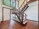 Staircase with a large window and tile floors at 11401 Cypress Dr, Clermont, FL 34711