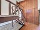 Staircase with wood paneling and tiled floors at 11401 Cypress Dr, Clermont, FL 34711