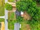 Aerial perspective of the property revealing a mature canopy of surrounding trees at 12181 Se 87Th Ct, Belleview, FL 34420