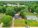 Aerial view of home showcasing mature trees, backyard and landscaping at 12181 Se 87Th Ct, Belleview, FL 34420