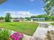 Expansive front yard view across the street with well-maintained lawn and neighboring homes in a tranquil neighborhood at 12181 Se 87Th Ct, Belleview, FL 34420