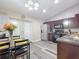 Cozy kitchen with dining space features stainless steel appliances and new flooring at 12181 Se 87Th Ct, Belleview, FL 34420