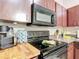 Close up of the oven and microwave of the kitchen at 12181 Se 87Th Ct, Belleview, FL 34420