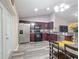 Updated kitchen features stainless steel appliances and modern dark wood cabinets at 12181 Se 87Th Ct, Belleview, FL 34420