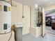 Spacious utility room showcasing the water heater, HVAC system, and water softener system at 12181 Se 87Th Ct, Belleview, FL 34420
