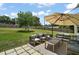 Spacious backyard with patio furniture and an umbrella at 126 E Beach St, Groveland, FL 34736