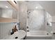 Elegant bathroom featuring marble tile, white vanity, and modern fixtures at 126 E Beach St, Groveland, FL 34736