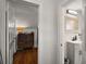 Hallway leading to a bedroom and bathroom, providing easy access to these spaces at 126 E Beach St, Groveland, FL 34736