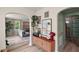 Stylish living room with a retro cabinet, unique artwork, and seamless transition to a cozy seating area at 126 E Beach St, Groveland, FL 34736