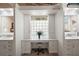 Elegant bathroom vanity area with great lighting, ample storage, and a serene, spa-like atmosphere at 13 Hickory Head Hammock, The Villages, FL 32159