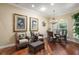 Cozy dining area with stylish furniture, pendant lighting, and elegant décor perfect for intimate gatherings at 13 Hickory Head Hammock, The Villages, FL 32159