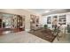 Cozy living room area with elegant decor, plush seating, and ample natural light at 13 Hickory Head Hammock, The Villages, FL 32159