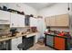 Functional workshop space featuring ample storage, a sink, and organized tool storage for various projects at 13 Hickory Head Hammock, The Villages, FL 32159
