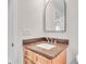 Bathroom vanity features modern arch mirror and stylish fixtures at 13334 Sw 107Th St, Dunnellon, FL 34432