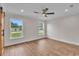 Bright bedroom with windows and barn door closet, offering a modern aesthetic at 13334 Sw 107Th St, Dunnellon, FL 34432