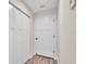 Hallway featuring closet and interior doors and wood look flooring at 13334 Sw 107Th St, Dunnellon, FL 34432