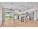 Open kitchen with stainless steel appliances, a large island, and sliding doors to the backyard at 13334 Sw 107Th St, Dunnellon, FL 34432