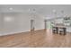 Spacious open floor plan with kitchen and living room, featuring hard floors and modern lighting at 13334 Sw 107Th St, Dunnellon, FL 34432