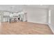 Open living space connects to the kitchen, featuring hard floors and natural light at 13334 Sw 107Th St, Dunnellon, FL 34432