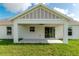 Covered back patio featuring a ceiling fan with access via sliding glass doors to the home's interior at 13334 Sw 107Th St, Dunnellon, FL 34432
