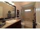 Bright bathroom with a shower/bathtub combo, tile flooring, and vanity with granite countertop at 1335 Eureka Mill Run, The Villages, FL 32162