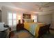 Bright bedroom with wood floors, tray ceilings, plantation shutters, and stylish decor at 1335 Eureka Mill Run, The Villages, FL 32162