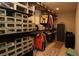 Walk-in closet with custom shelves and hanging racks provides organized storage solutions at 1335 Eureka Mill Run, The Villages, FL 32162