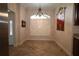 Elegant dining area featuring tile floors, decorative chandelier, and stylish window shutters at 1335 Eureka Mill Run, The Villages, FL 32162